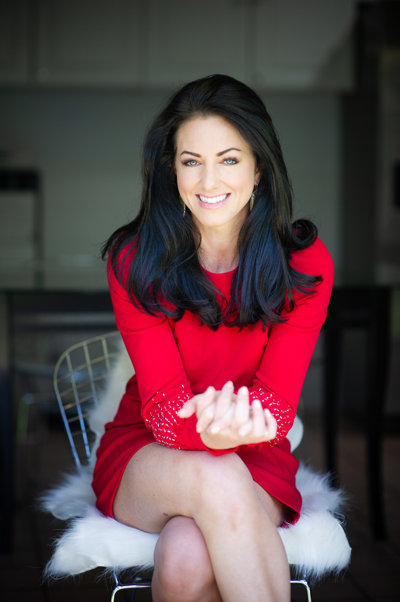 Erin Jones smiling in a red dress